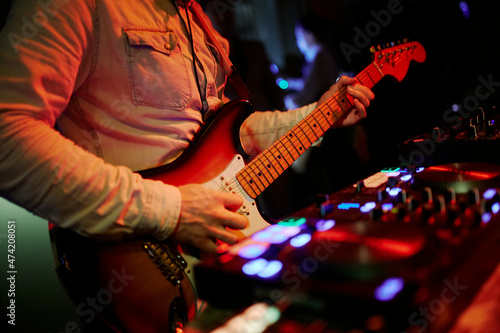 close-up of an electric guitar in a concert