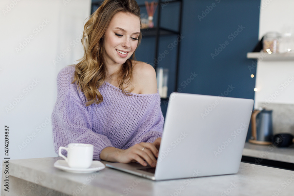 Young woman working at home, cozy portrait indoor Young woman working at home, cozy portrait indoor