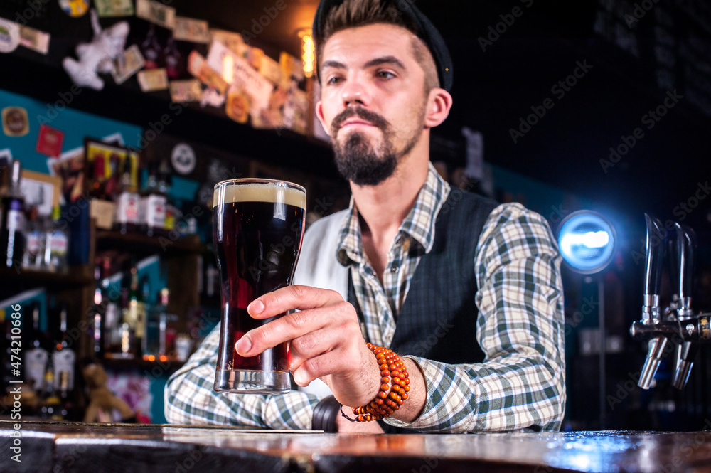 Barman mixes a cocktail at the saloon