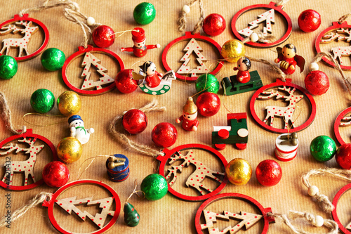 Christmas decorations and chocolate candy on wrapping paper