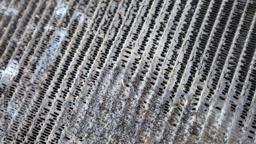 Close up evaporator Dirty cars. Old evaporator. Nasty with mucus and dust clumping on air fins. selective focus photo