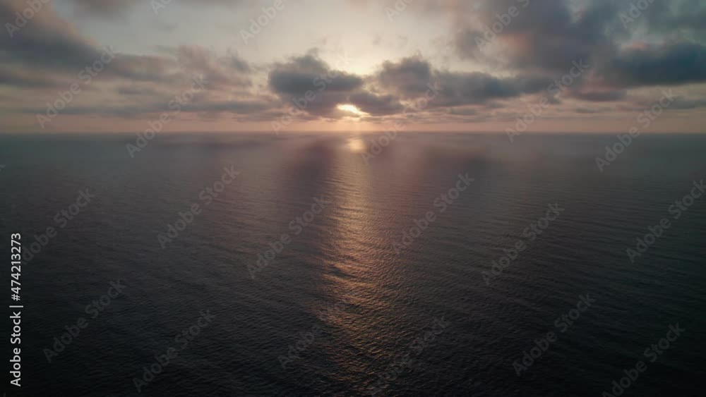 Sunrise over the sea.Epic view of the ocean and reflection of clouds and sun. Sunrise over the sea.Epic view of the ocean and reflection of clouds and sun.
