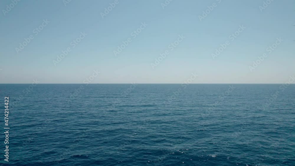 Flight over the water, sea waves, sunrise. A flight over the surface of a calm ocean. Flight over the water, sea waves, sunrise. A flight over the surface of a calm ocean.