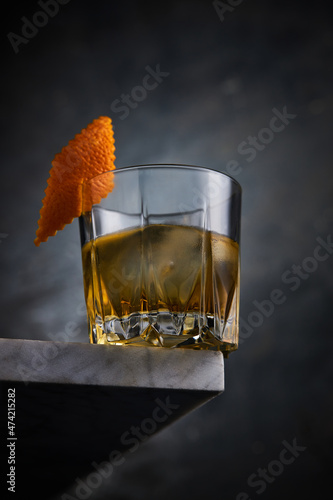 Scotch whiskey with orange peel photo