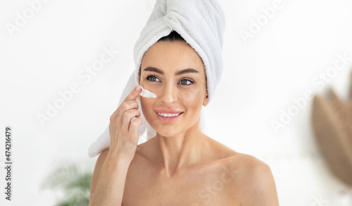 Beautiful young woman make mask for fresh skin. Female beauty face care, facial treatment