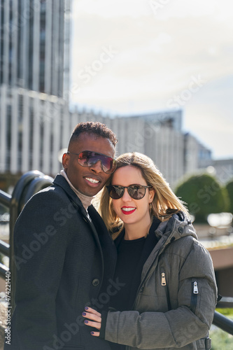 Happy diverse couple on street