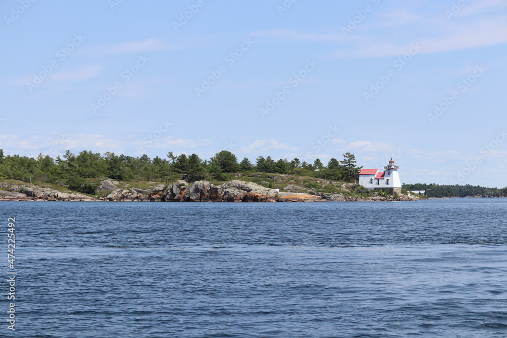 Obraz premium Lighthouse Lake and Rocks
