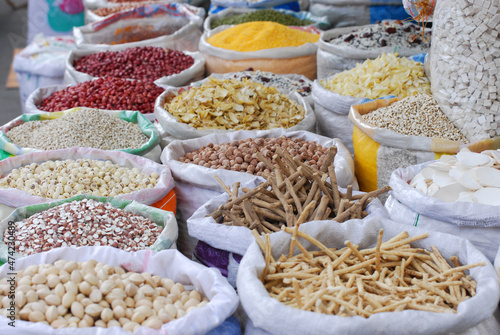 market with Asian seasoning stall and dried food