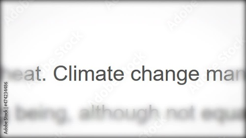 CLOSE-UP: Breaking news about climate change. Macro shot of rapidly changing headlines of articles in the media about the problem of global warming. Concept of environmental protection.