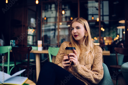 Young lady resting in modern cafe