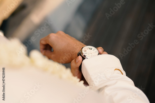 Man's watch on hand. Wedding ceremony 