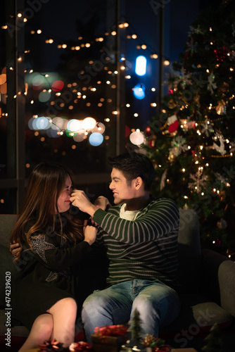young Asian couple in night...