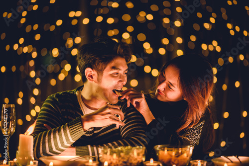 young Asian couple in night...