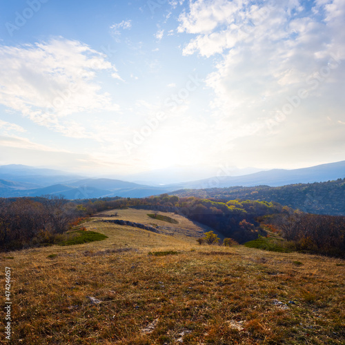 view from mountain plateau to the bright sunset