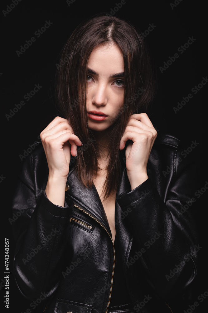 Fashionable woman with perfect skin on black background Fashionable woman with perfect skin on black background