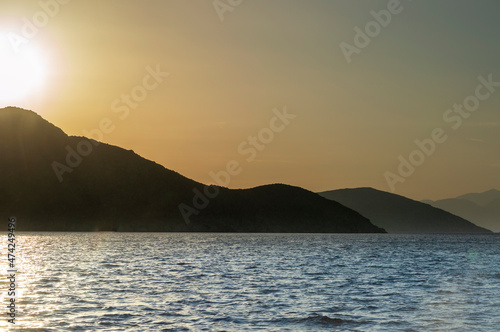 View of a seunset over Aegean Sea Greek islands. Hills silhouett