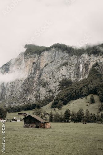 swiss valley with waterfall from aerial view