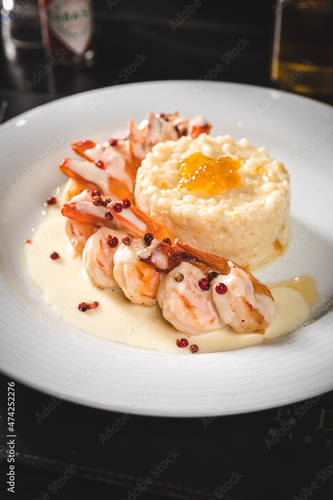 Perfect Seafood Menu Dish Plate Food Octopus Salmon, Shrimp Risotto Pasta Vegetables Salad Fish on a Dark Background Perfect Seafood Menu Dish Plate Food Octopus Salmon, Shrimp Risotto Pasta Vegetables Salad Fish on a Dark Background