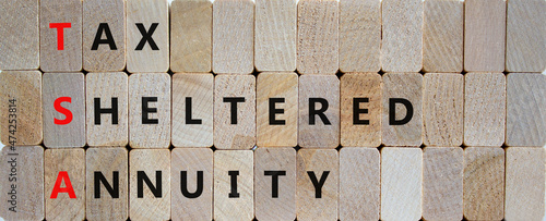 TSA, tax sheltered annuary symbol. Concept words TSA, tax sheltered annuary on wooden blocks. Beautiful wooden background, copy space. Business and TSA, tax sheltered annuary concept.