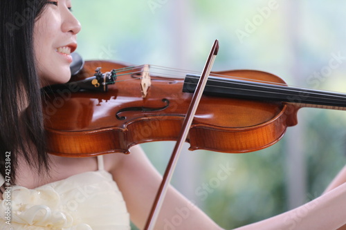 Wallpaper Mural young woman musician playing fiddle violin music instrument, classical violinist