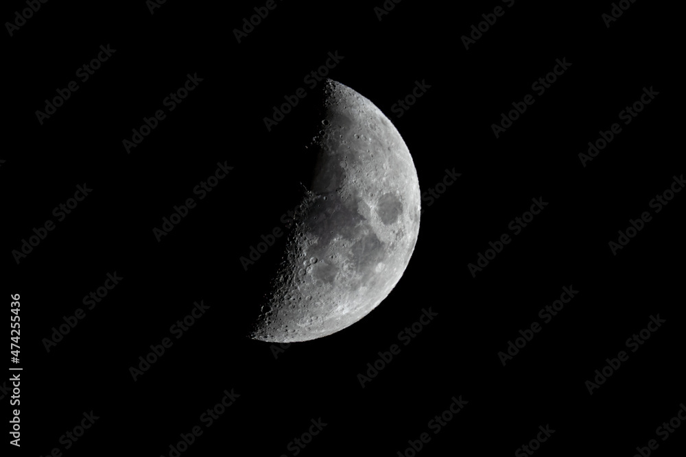 Close up of a waxing crescent moon and lunar surface on 10 December 2021 Close up of a waxing crescent moon and lunar surface on 10 December 2021