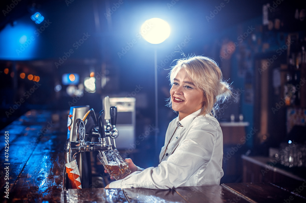 Charismatic girl barman makes a show creating a cocktail at the bar counter