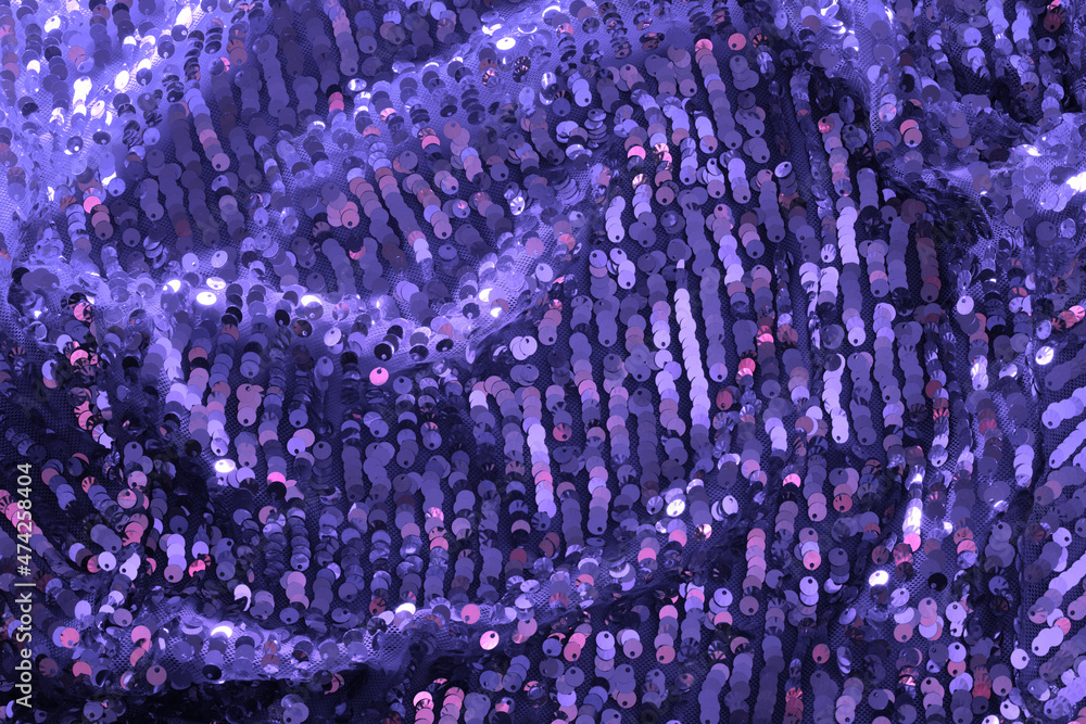 Shiny and glittering fabric with sequins in color of the Year 2022, Very Peri. Abstract background. Events, celebrations, Christmas, New Year. Trendy violet backdrop. Shiny and glittering fabric with sequins in color of the Year 2022, Very Peri. Abstract background. Events, celebrations, Christmas, New Year. Trendy violet backdrop.