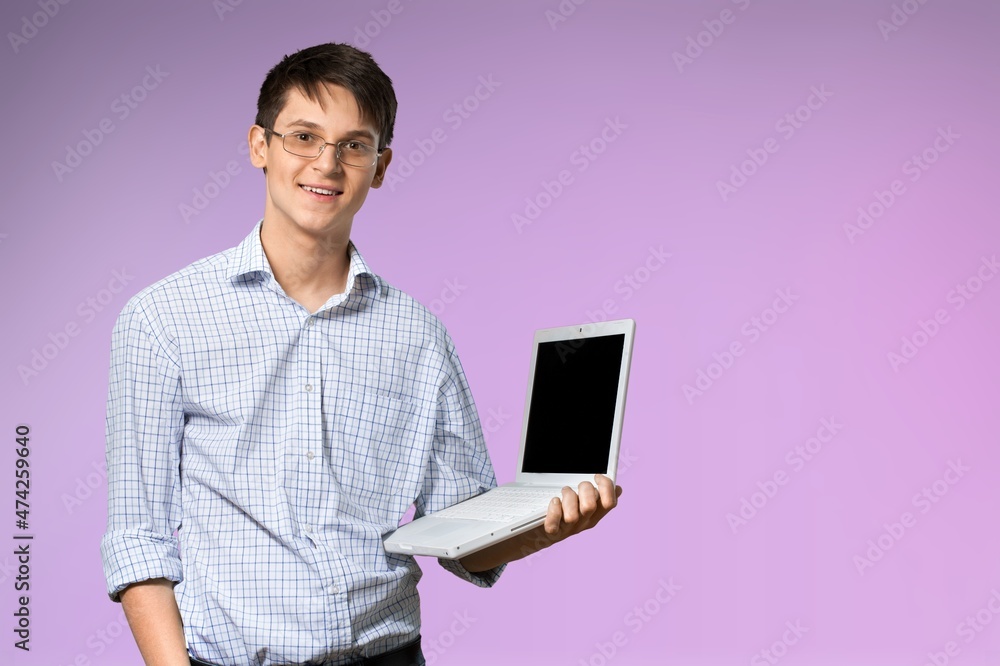 Young boy student hold use work on laptop pc computer Young boy student hold use work on laptop pc computer