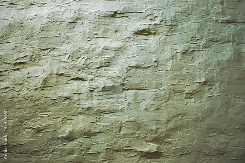 white concrete wall plastered with rough trowel strokes