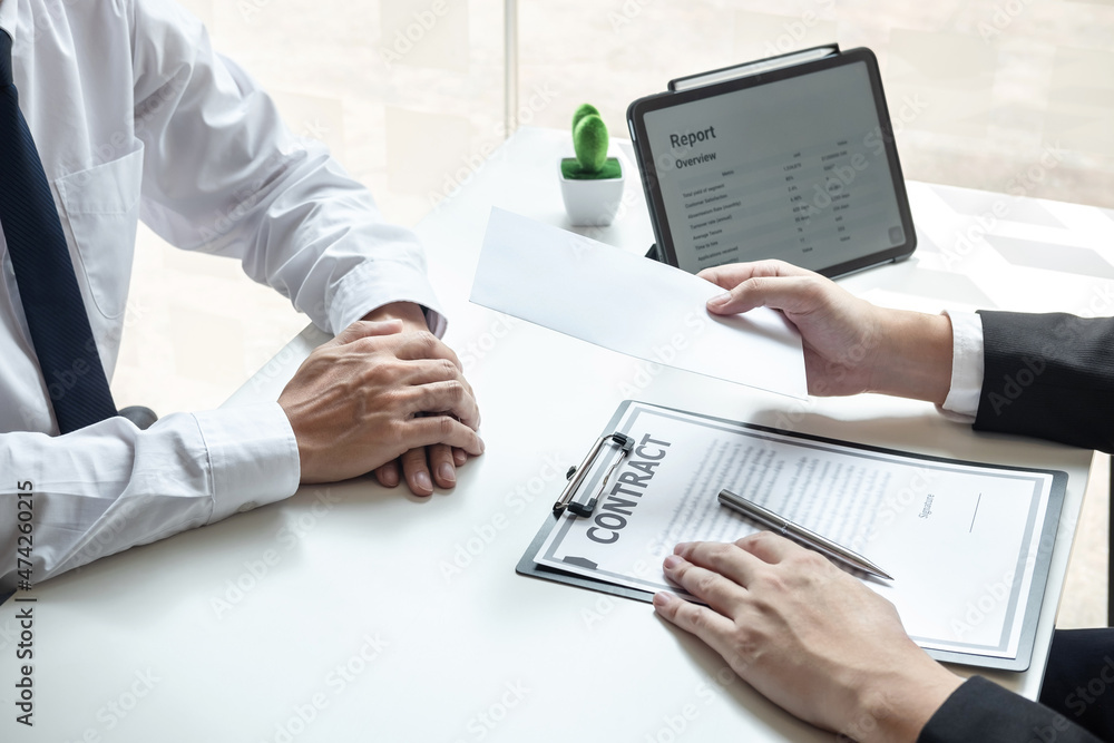 Employer sending resignation letter to employee consider in order to contract for quit or layoff of job leaving from work, resignation concept Employer sending resignation letter to employee consider in order to contract for quit or layoff of job leaving from work, resignation concept