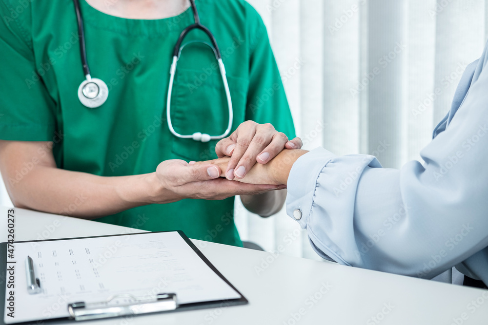Hand of doctor touching patient reassuring for encouragement and empathy to support while medical examination on the hospital Hand of doctor touching patient reassuring for encouragement and empathy to support while medical examination on the hospital