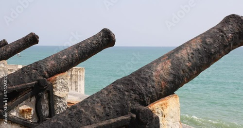 Elmina Castle Ghana canon defensive wall ocean pan. Ghana West Africa on the Atlantic ocean. Erected by the Portuguese in 1482. Over 500 years it was owned by the Dutch and British. R102 photo