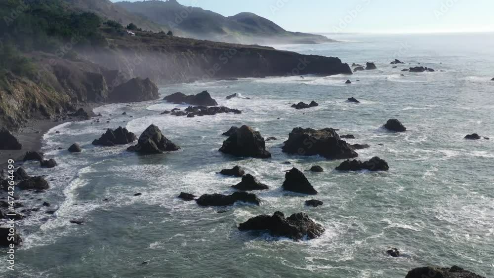 Video „The Pacific Ocean gently washes against sea stacks off the ...