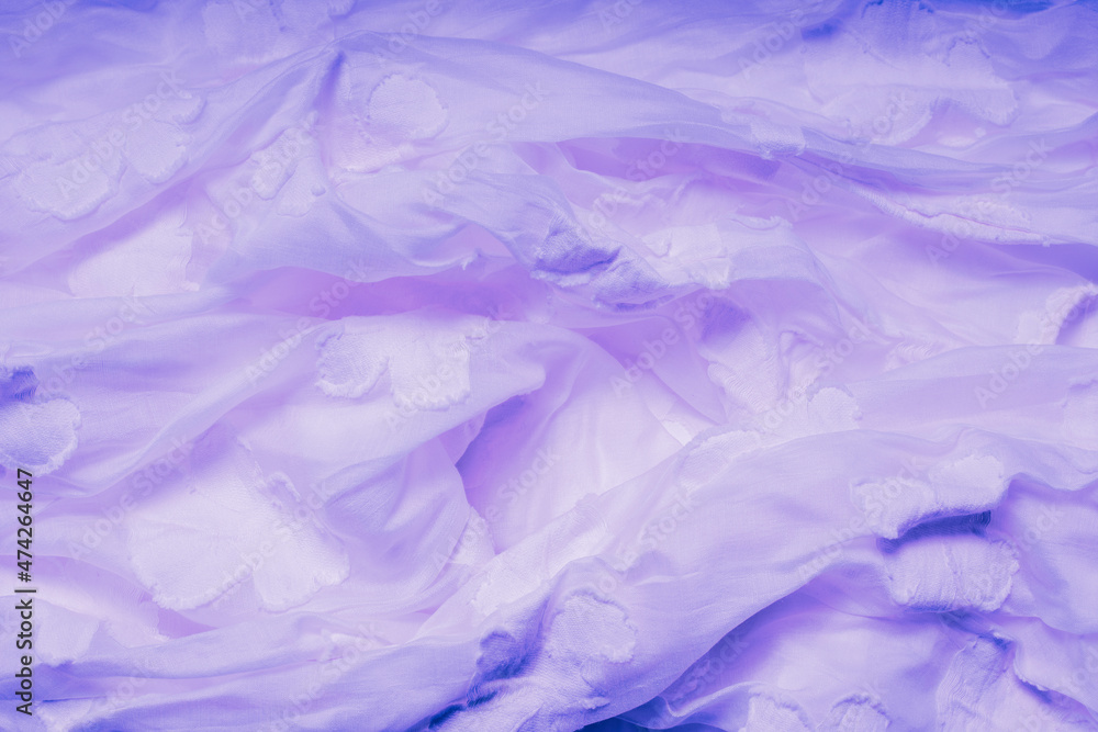 Fabric in Color of the Year 2022, Very Peri. Highly detailed closeup of crumpled violet textile. Abstract background.