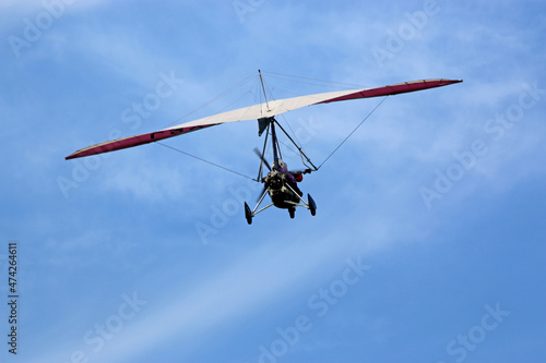 Canvas-taulu Ultralight airplane flying in a blue sky