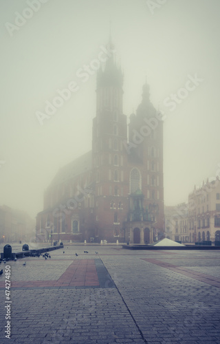 St Mary's church on Krakow Main Square in the thick fog, Poland.