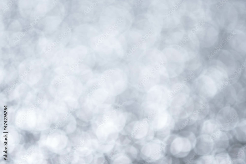 Bright silver lights sparkling background with star. Chrismas background