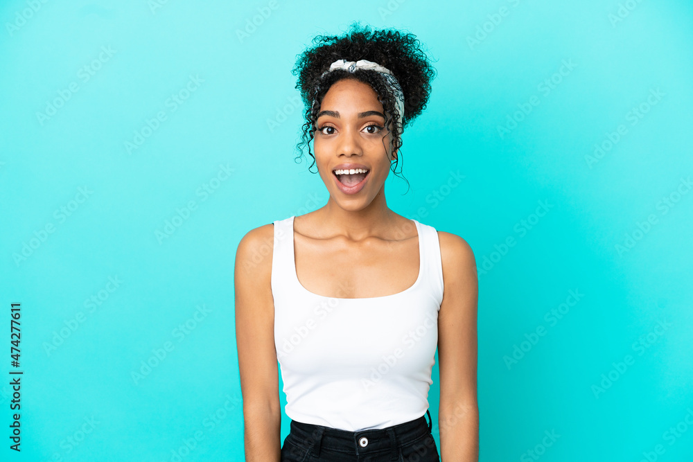 Young latin woman isolated on blue background with surprise facial expression Young latin woman isolated on blue background with surprise facial expression