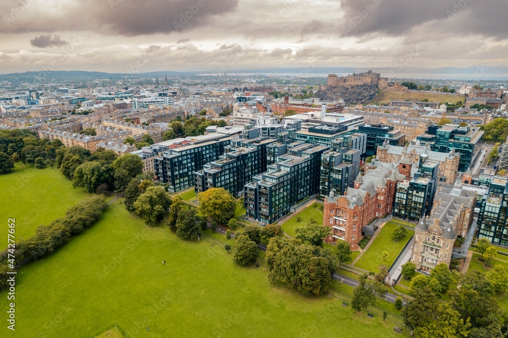 Obraz premium Edinburgh aerial top view. The neo-gothic structures of Edinburgh’s historic castle form silhouettes against the sky, providing a romantic view that has attracted visitors for years