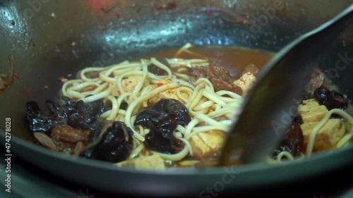 Chef Is Cooking Udon Noodles With Meat, Vegetables And Tofu.