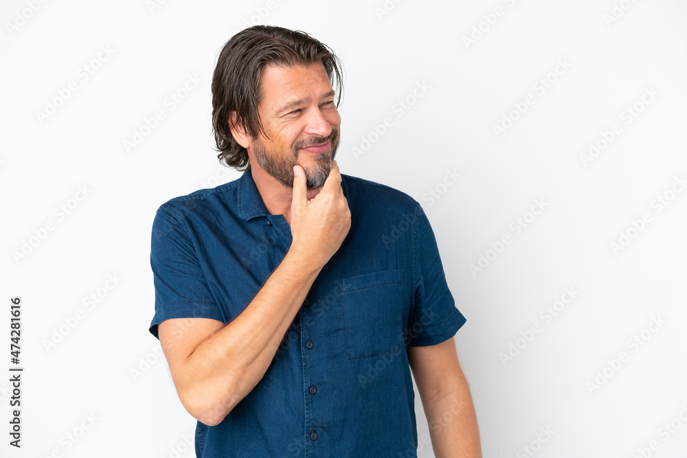 Senior dutch man isolated on white background looking to the side and smiling Senior dutch man isolated on white background looking to the side and smiling