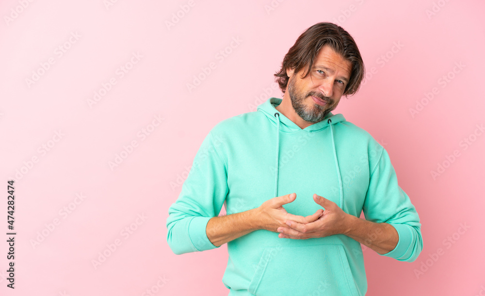 Senior dutch man isolated on pink background laughing Senior dutch man isolated on pink background laughing