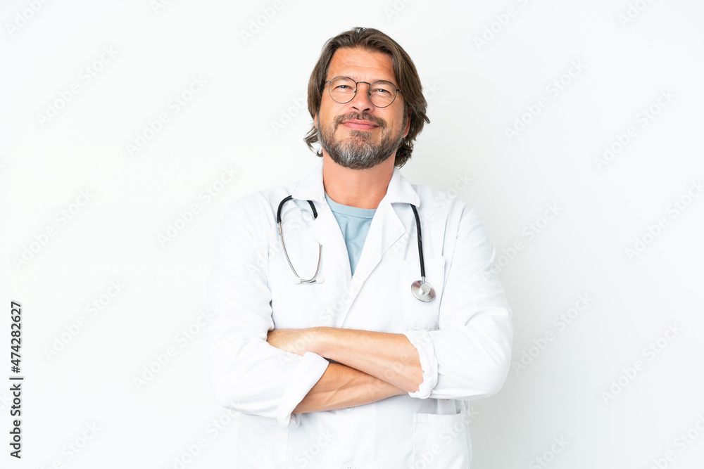 Senior dutch man isolated on white background wearing a doctor gown and with arms crossed Senior dutch man isolated on white background wearing a doctor gown and with arms crossed