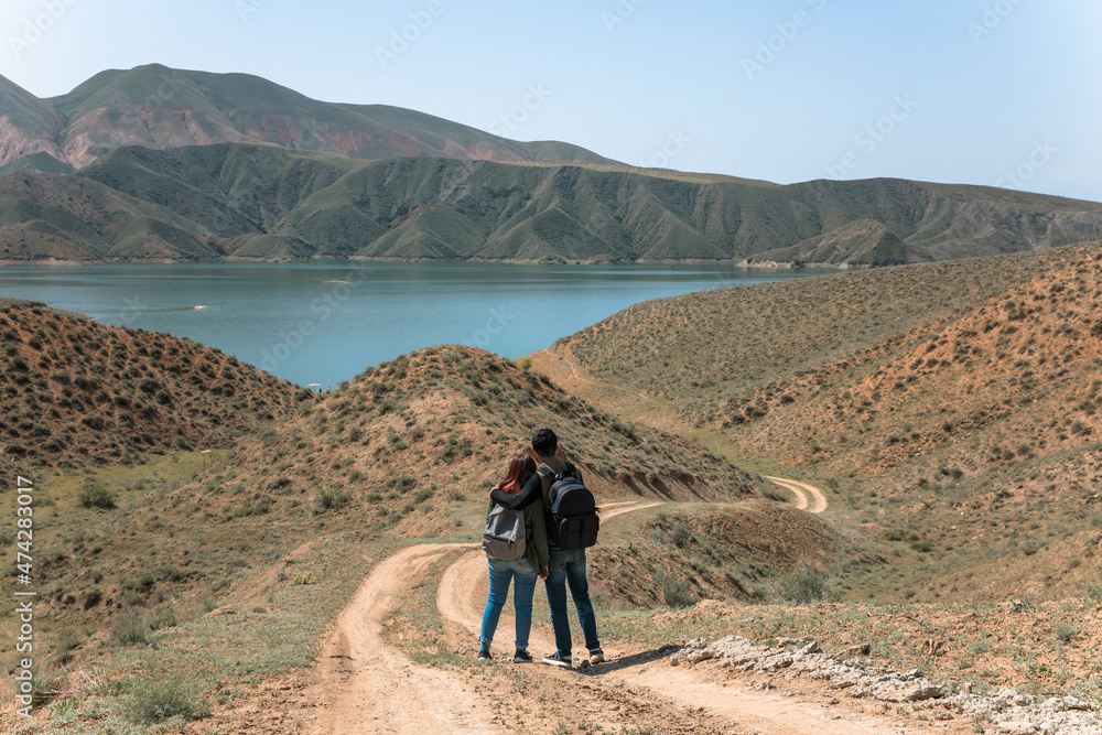 couple in mountain and lake background