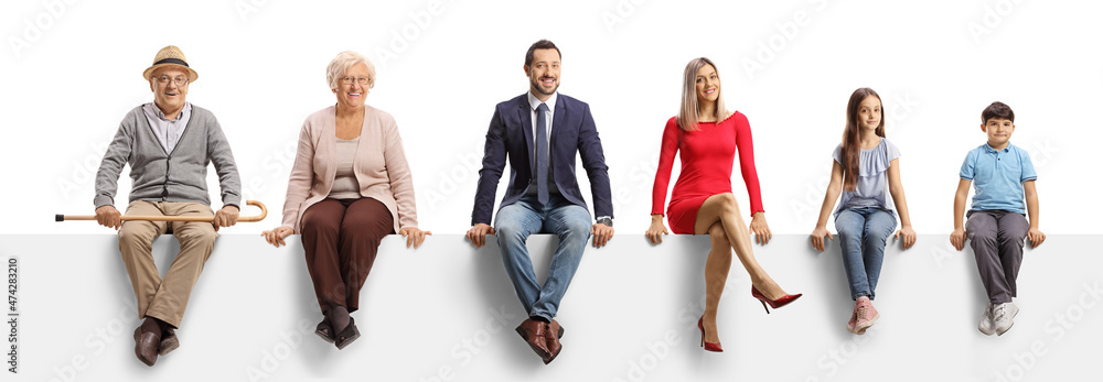 A family of three generations sitting on a blank panel and smiling at camera - obrazy, fototapety, plakaty 