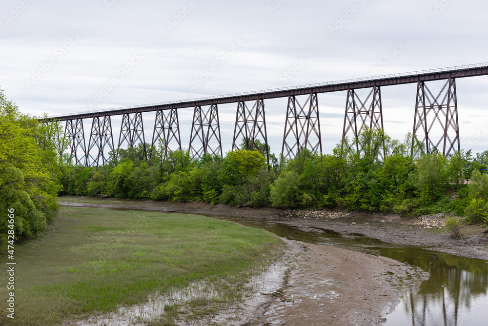 Fototapeta premium View of the Cap-Rouge railroad trestle bridge built in 1908 and the Cap Rouge river