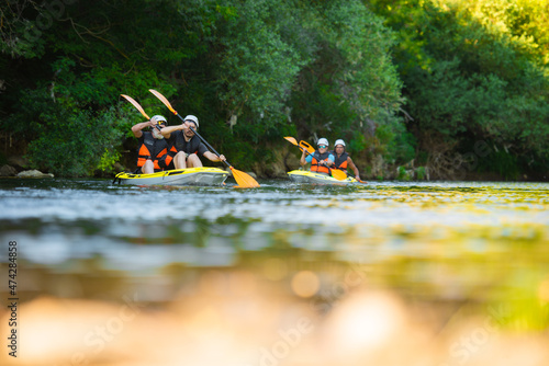 Two pairs kayaking © qunica.com