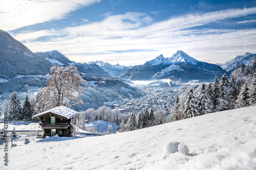Idylic mountain hut above the snow-covered Berchtesgaden, Bavaria, Germany