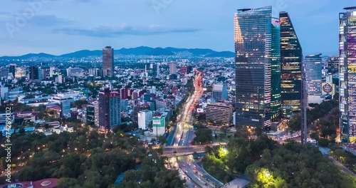 México, CDMX, Beautiful Aerial Drone Hyperlapse view of urban modern Mexico City center with tall skyscrapers and flashing City lights at night, drone images