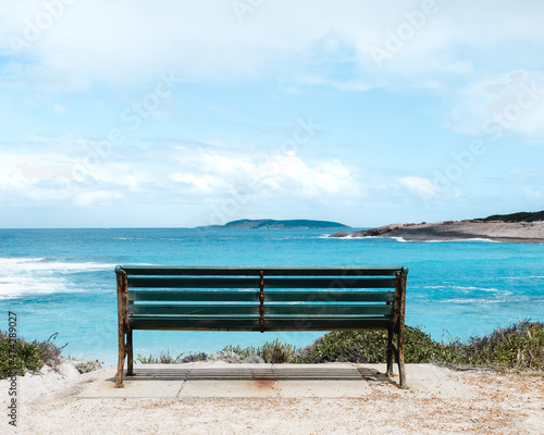 Sit at the bench and watch the beauty summer-day beach.  © Jay